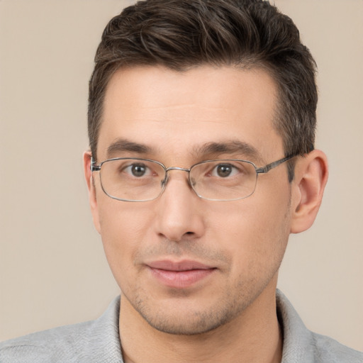 Joyful white adult male with short  brown hair and brown eyes