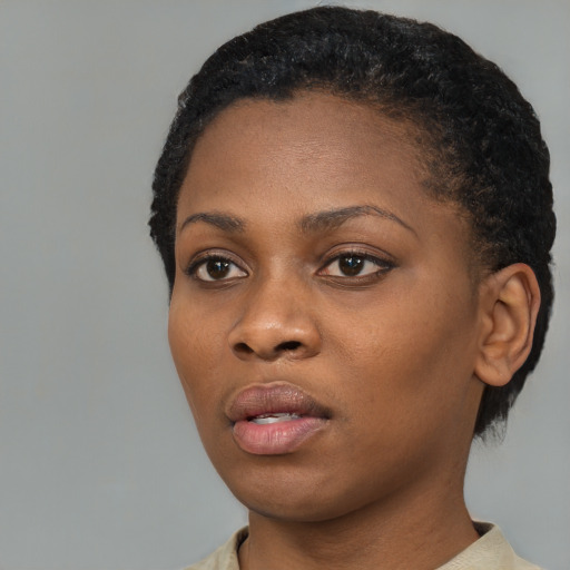 Neutral black young-adult female with short  black hair and brown eyes