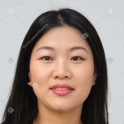 Joyful asian young-adult female with long  brown hair and brown eyes