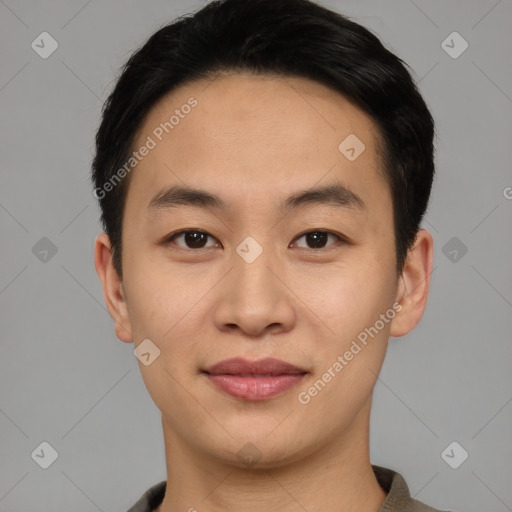 Joyful asian young-adult male with short  black hair and brown eyes