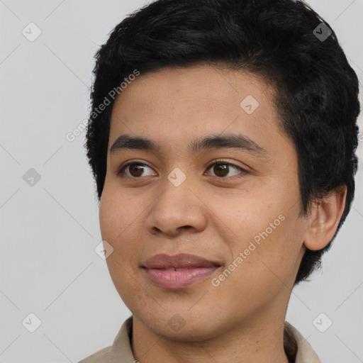 Joyful asian young-adult male with short  black hair and brown eyes