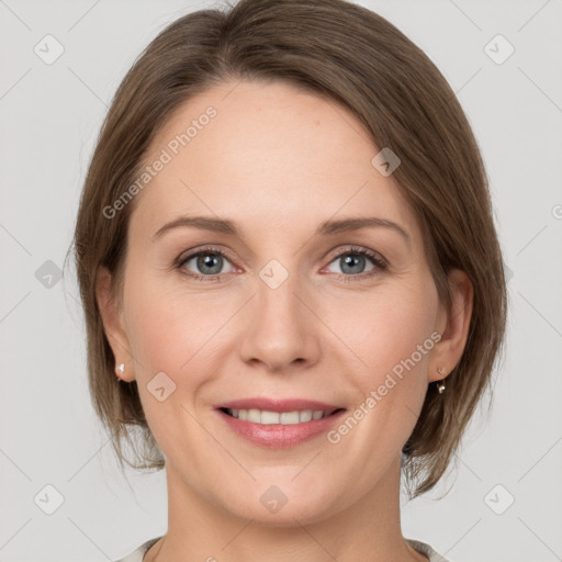 Joyful white adult female with medium  brown hair and grey eyes