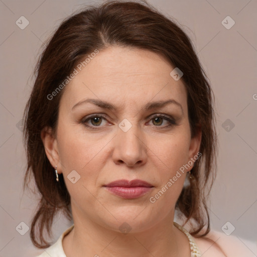 Joyful white adult female with medium  brown hair and grey eyes