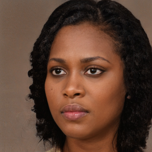 Neutral black young-adult female with long  black hair and brown eyes