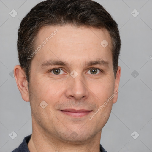 Joyful white adult male with short  brown hair and grey eyes