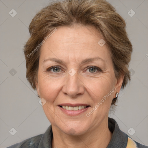 Joyful white middle-aged female with medium  brown hair and grey eyes