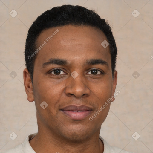 Joyful black young-adult male with short  brown hair and brown eyes