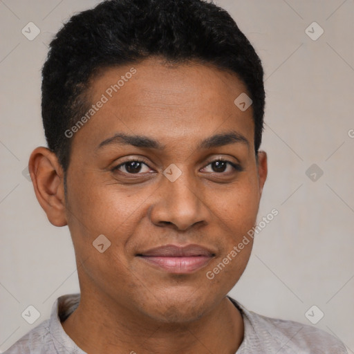 Joyful black young-adult male with short  brown hair and brown eyes