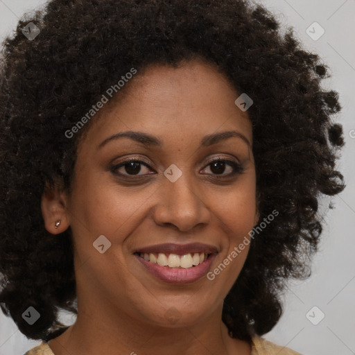 Joyful black young-adult female with medium  brown hair and brown eyes