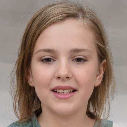 Joyful white child female with medium  brown hair and grey eyes