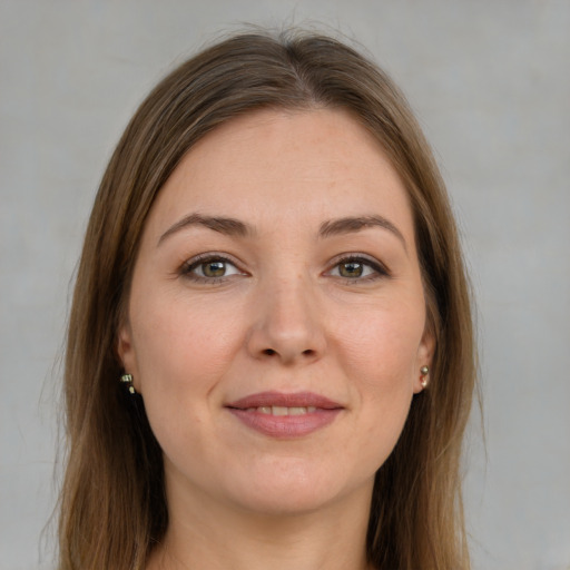 Joyful white young-adult female with long  brown hair and grey eyes