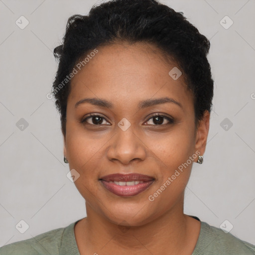 Joyful black young-adult female with short  black hair and brown eyes