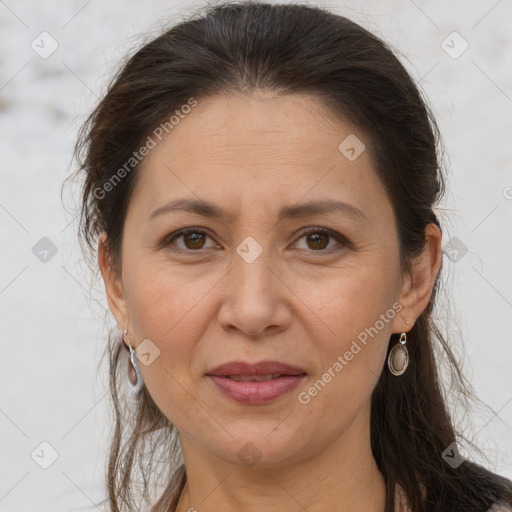 Joyful white adult female with long  brown hair and brown eyes