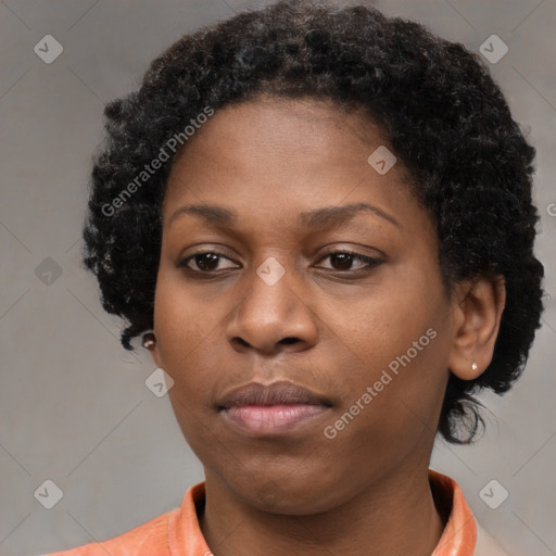 Neutral black young-adult female with medium  brown hair and brown eyes