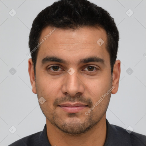 Joyful white young-adult male with short  black hair and brown eyes