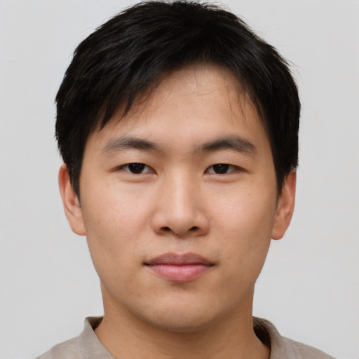 Neutral asian young-adult male with short  brown hair and brown eyes
