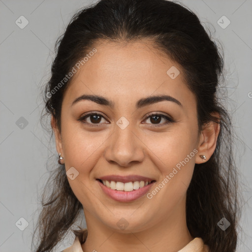 Joyful latino young-adult female with medium  brown hair and brown eyes