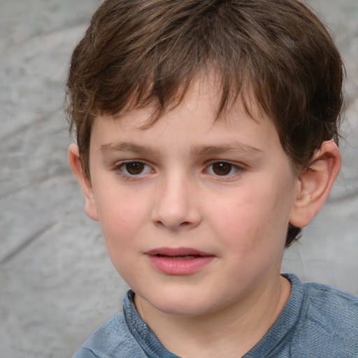 Joyful white child male with short  brown hair and grey eyes