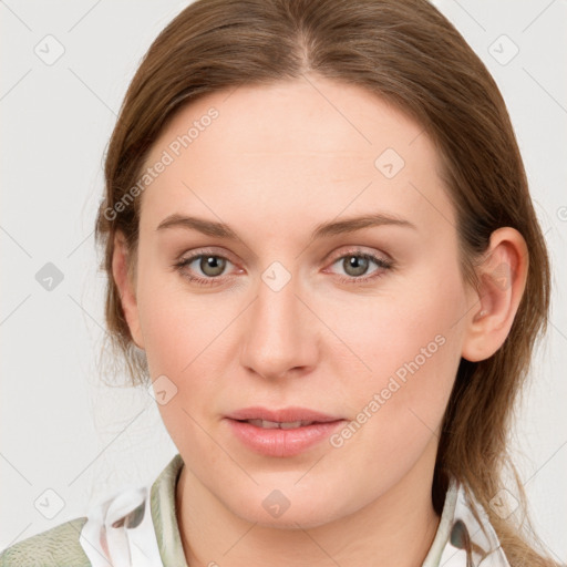 Joyful white young-adult female with medium  brown hair and blue eyes