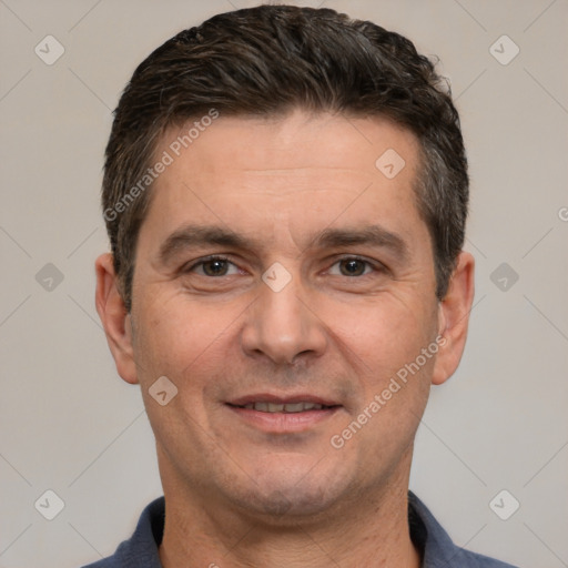 Joyful white adult male with short  brown hair and brown eyes