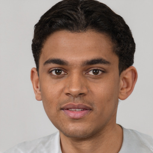 Neutral black young-adult male with short  black hair and brown eyes