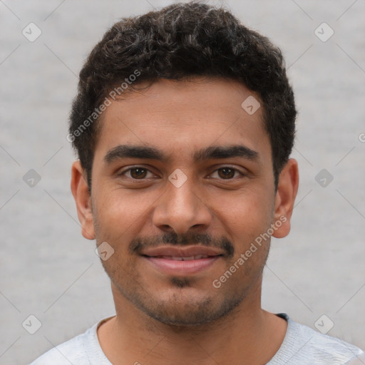 Joyful latino young-adult male with short  brown hair and brown eyes