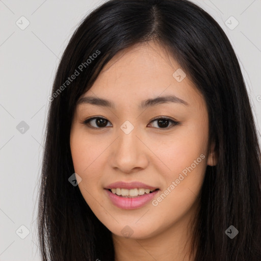 Joyful asian young-adult female with long  brown hair and brown eyes