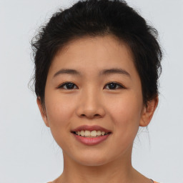 Joyful asian young-adult female with short  brown hair and brown eyes