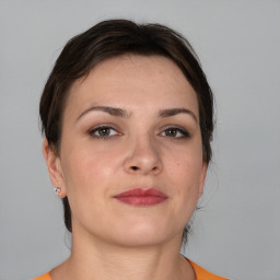 Neutral white young-adult female with short  brown hair and brown eyes