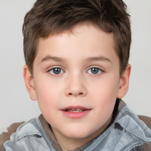 Joyful white child male with short  brown hair and brown eyes