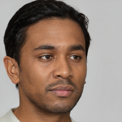 Neutral black young-adult male with short  brown hair and brown eyes