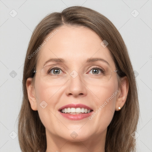 Joyful white adult female with medium  brown hair and grey eyes