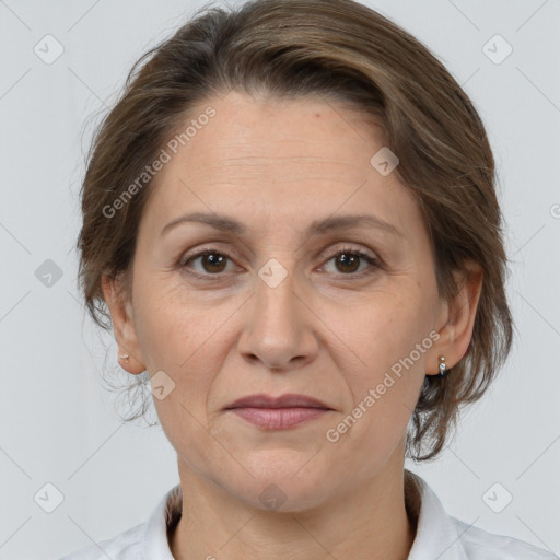 Joyful white adult female with medium  brown hair and brown eyes