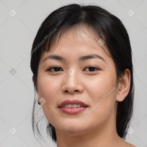 Joyful asian young-adult female with medium  brown hair and brown eyes