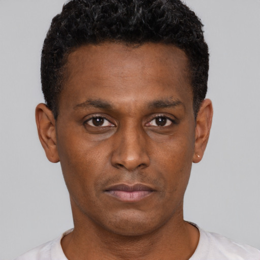 Neutral black young-adult male with short  brown hair and brown eyes