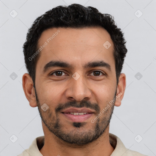 Joyful latino young-adult male with short  brown hair and brown eyes