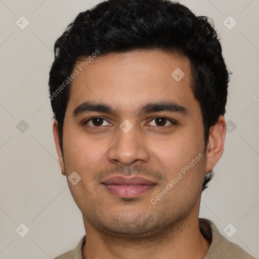 Joyful latino young-adult male with short  black hair and brown eyes