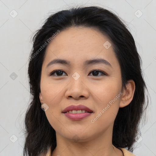 Joyful asian young-adult female with medium  brown hair and brown eyes