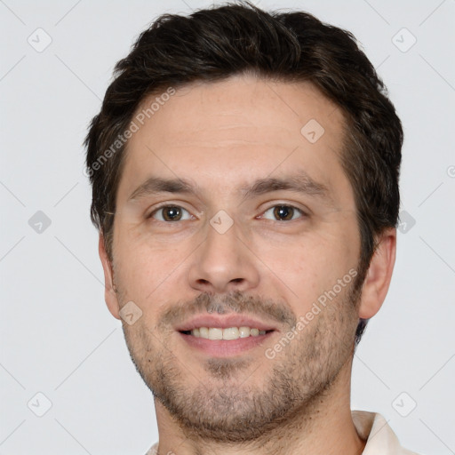 Joyful white adult male with short  brown hair and brown eyes