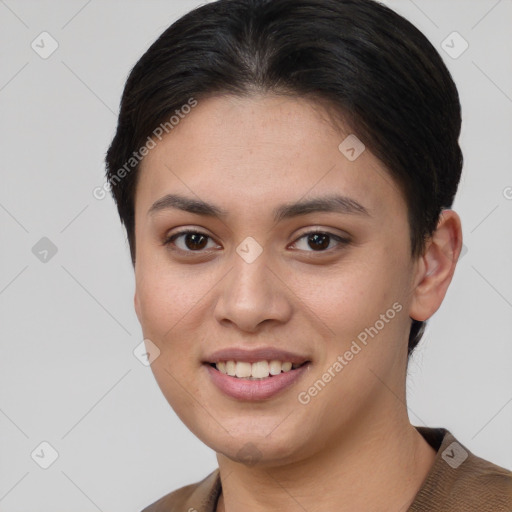 Joyful asian young-adult female with short  brown hair and brown eyes