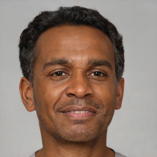 Neutral black adult male with short  black hair and brown eyes