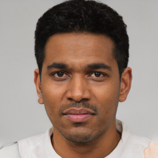 Neutral latino young-adult male with short  black hair and brown eyes