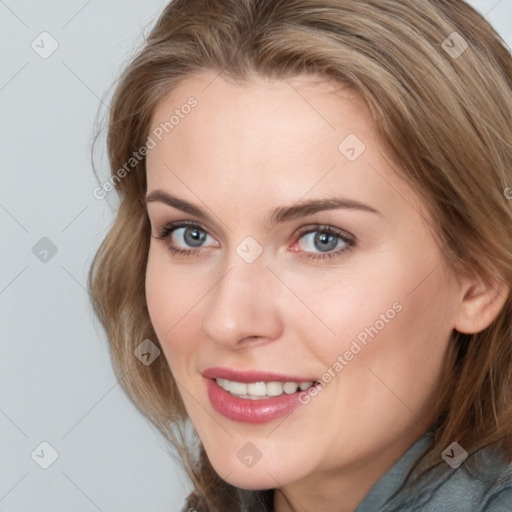 Joyful white young-adult female with medium  brown hair and blue eyes