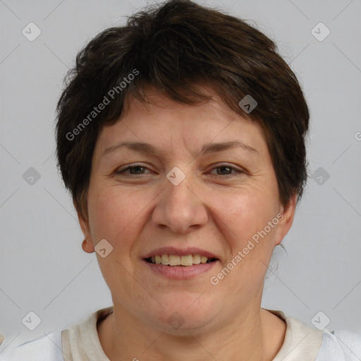 Joyful white adult female with short  brown hair and brown eyes