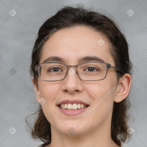 Joyful white young-adult female with medium  brown hair and grey eyes