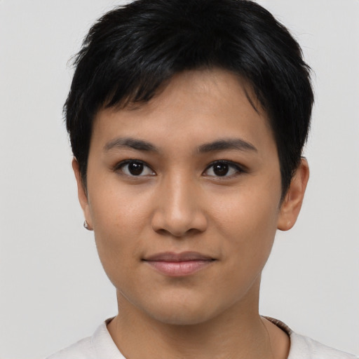 Joyful asian young-adult female with short  black hair and brown eyes