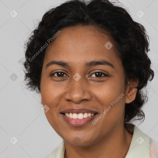 Joyful black young-adult female with long  brown hair and brown eyes