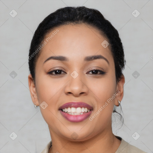 Joyful latino young-adult female with short  black hair and brown eyes