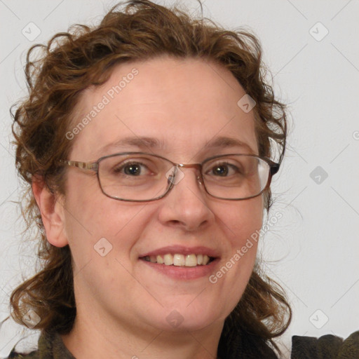 Joyful white adult female with medium  brown hair and blue eyes