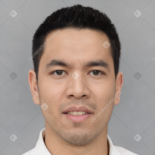 Joyful asian young-adult male with short  black hair and brown eyes